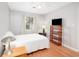 Well-lit bedroom features neutral walls, wood floors, and a ceiling fan at 3700 Golf Colony Lane # 26A, Little River, SC 29566