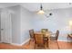 Intimate dining area featuring laminate flooring and a decorative light fixture at 3700 Golf Colony Lane # 26A, Little River, SC 29566