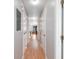 Long hallway featuring laminate wood flooring and multiple doors leading to various rooms at 3700 Golf Colony Lane # 26A, Little River, SC 29566