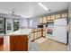 Functional kitchen featuring essential appliances and access to the back patio at 3700 Golf Colony Lane # 26A, Little River, SC 29566
