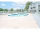Enjoy the community outdoor pool with relaxing lounge area and manicured landscaping at 3700 Golf Colony Lane # 26A, Little River, SC 29566