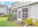 The screened sunroom with a garden view extends the living space of this inviting condo at 3700 Golf Colony Lane # 26A, Little River, SC 29566