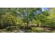 Charming home nestled among mature trees, offering a serene and private setting with a welcoming front porch at 3772 Brown Bark Ln., Murrells Inlet, SC 29576