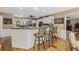 Bright kitchen features granite countertop island, barstool seating, and stainless appliances at 3772 Brown Bark Ln., Murrells Inlet, SC 29576
