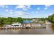 Picturesque view of a marina with boats docked along the pier on a sunny day at 3772 Brown Bark Ln., Murrells Inlet, SC 29576