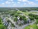 A birds-eye view shows a complex with well-kept landscaping, tree coverage, and convenient access to nearby roadways at 4344 Spa Dr. # 605, Little River, SC 29566