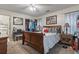 A comfortable bedroom with carpeted floors and a well-lit closet, providing ample storage solutions at 4344 Spa Dr. # 605, Little River, SC 29566