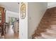 The entryway features a staircase, hardwood floors and offers a glimpse into the bright and open living spaces at 4344 Spa Dr. # 605, Little River, SC 29566