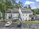 Well-maintained condo complex features classic white siding and neatly painted stairs in a desirable neighborhood at 4344 Spa Dr. # 605, Little River, SC 29566
