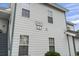 Close-up of a condo unit showing the house number and multiple windows with natural light at 4344 Spa Dr. # 605, Little River, SC 29566