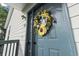 Charming front door with a decorative wreath at 4344 Spa Dr. # 605, Little River, SC 29566