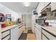 Well-lit kitchen featuring appliances, wood floors, and ample cabinet space at 4344 Spa Dr. # 605, Little River, SC 29566
