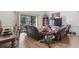 Comfortable living room with leather recliners and sliding glass doors to outdoor deck at 4344 Spa Dr. # 605, Little River, SC 29566