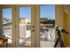 Outdoor balcony with white railings and chairs, offering scenic neighborhood views at 4806 S Ocean Blvd., Surfside Beach, SC 29575