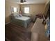 Bedroom featuring hardwood floors, and a dresser with mirror at 4806 S Ocean Blvd., Surfside Beach, SC 29575