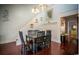 Dining area with a spacious table and views of the stairs at 4806 S Ocean Blvd., Surfside Beach, SC 29575