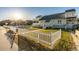 Exterior shot showcasing the home's fenced yard, inviting deck, and upper-level balconies at 4806 S Ocean Blvd., Surfside Beach, SC 29575