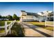Exterior view featuring a long driveway and a well-manicured lawn at 4806 S Ocean Blvd., Surfside Beach, SC 29575