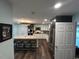 Bright kitchen featuring an island with seating, pendant lighting, and stainless steel appliances at 4806 S Ocean Blvd., Surfside Beach, SC 29575