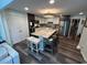 Spacious kitchen boasting an island with seating, stainless steel appliances, and ample cabinet space at 4806 S Ocean Blvd., Surfside Beach, SC 29575
