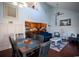 Cozy living room featuring vaulted ceilings, an open floor plan, and sleek hardwood floors at 4806 S Ocean Blvd., Surfside Beach, SC 29575