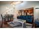 Bright living room with a comfortable sofa, hardwood floors, and an open floor plan at 4806 S Ocean Blvd., Surfside Beach, SC 29575