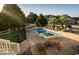Beautiful backyard featuring a pool, hot tub, patio, lounge chairs, and manicured landscaping at 4806 S Ocean Blvd., Surfside Beach, SC 29575