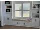 Charming window seat with built-in bookshelves and storage cabinets at 4806 S Ocean Blvd., Surfside Beach, SC 29575