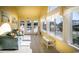 Bright sunroom with large windows, comfortable seating, and lots of natural light at 4806 S Ocean Blvd., Surfside Beach, SC 29575