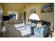 Bright sunroom with a comfortable sofa and sunny views at 4806 S Ocean Blvd., Surfside Beach, SC 29575