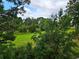 Lush green backyard and beautiful views seen from the balcony at 500 Fairway Village Dr. # 9-K, Myrtle Beach, SC 29588