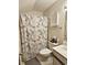 Full bath with vanity and floral curtained shower at 500 Fairway Village Dr. # 9-K, Myrtle Beach, SC 29588