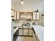Functional kitchen featuring white cabinetry, laminate countertops, and stainless steel sink at 500 Fairway Village Dr. # 9-K, Myrtle Beach, SC 29588