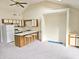 Bright kitchen featuring a breakfast bar, neutral carpet, white appliances and vaulted ceiling at 500 Fairway Village Dr. # 9-K, Myrtle Beach, SC 29588