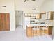 Open-concept kitchen with breakfast bar, neutral carpet, and vaulted ceiling at 500 Fairway Village Dr. # 9-K, Myrtle Beach, SC 29588