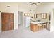 Inviting kitchen with a breakfast bar, neutral carpet, white appliances and vaulted ceiling at 500 Fairway Village Dr. # 9-K, Myrtle Beach, SC 29588