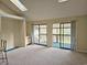 Open living area with two skylights and access to the balcony, creating a naturally lit space at 500 Fairway Village Dr. # 9-K, Myrtle Beach, SC 29588