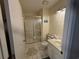 Cozy bathroom featuring a shower with glass door, toilet, and vanity with light at 5001 Little River Rd. # W101, Myrtle Beach, SC 29577