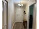 The condo's entrance features a light fixture, wood-look flooring, and a closet for storage at 5001 Little River Rd. # W101, Myrtle Beach, SC 29577