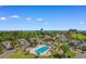 Aerial view of the community pool with surrounding buildings and golf course in background at 503 20Th Ave. N # 29-C, North Myrtle Beach, SC 29582
