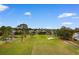 Aerial view of the lush golf course and pond in a beautiful community with mature trees at 503 20Th Ave. N # 29-C, North Myrtle Beach, SC 29582