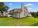 Expansive backyard featuring a well-maintained lawn and a patio area perfect for outdoor dining at 503 20Th Ave. N # 29-C, North Myrtle Beach, SC 29582