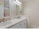 Bathroom featuring double sinks, decorative mirrors, and a tiled floor at 503 20Th Ave. N # 29-C, North Myrtle Beach, SC 29582