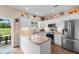 Bright kitchen with white cabinets, granite countertops, stainless steel appliances, and outdoor views at 503 20Th Ave. N # 29-C, North Myrtle Beach, SC 29582