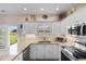 Well-lit kitchen with modern appliances, granite countertops, and direct access to the outdoor area at 503 20Th Ave. N # 29-C, North Myrtle Beach, SC 29582