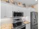 Close-up of kitchen with stainless steel appliances, granite countertops, and decorative accents at 503 20Th Ave. N # 29-C, North Myrtle Beach, SC 29582