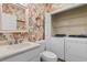 This lovely powder room conveniently conceals laundry appliances behind white paneled doors at 503 20Th Ave. N # 29-C, North Myrtle Beach, SC 29582
