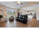 Bright living room with hardwood floors, a ceiling fan, and lots of natural light at 503 20Th Ave. N # 29-C, North Myrtle Beach, SC 29582