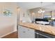 Open floor plan with kitchen island, living area, and staircase, creating a bright, inviting atmosphere at 503 20Th Ave. N # 29-C, North Myrtle Beach, SC 29582