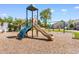 Beautiful community playground with climbing wall, slide, swings, and mulch ground cover at 503 20Th Ave. N # 29-C, North Myrtle Beach, SC 29582